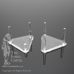 A pair of acrylic triangle peg stands against a black background