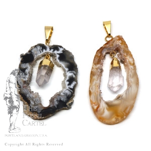 Agate geode slice pendants with quartz crystals linked in the middle featuring gold plated bails against a white background