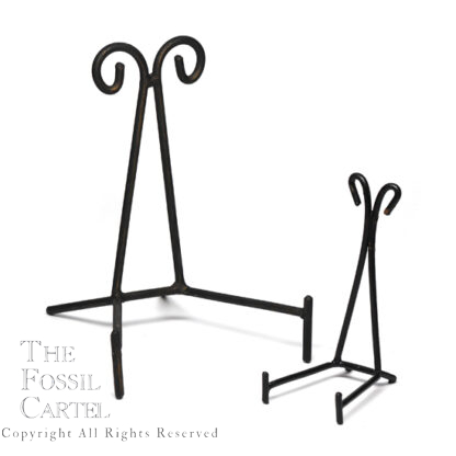 A pair of black wrought iron triangle stands against a white background