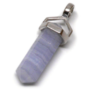 A simple crystal-shaped pendant made from a vogel cut blue lace agate set in sterling silver against a white background.