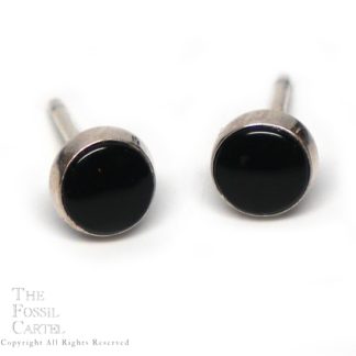 A set of round black onyx sterling silver stud earrings against a white background