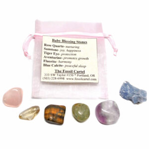 A baby blessing healing pouch featuring tumbled rose quartz, sunstone, tiger's eye, aventurine, fluorite, and blue calcite