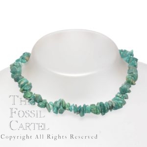 A necklace made of tumbled amazonite chips against a white background