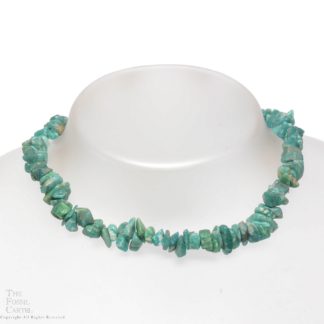 A necklace made of tumbled amazonite chips against a white background