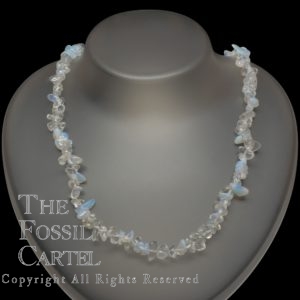 A necklace made of opalite chips against a black background