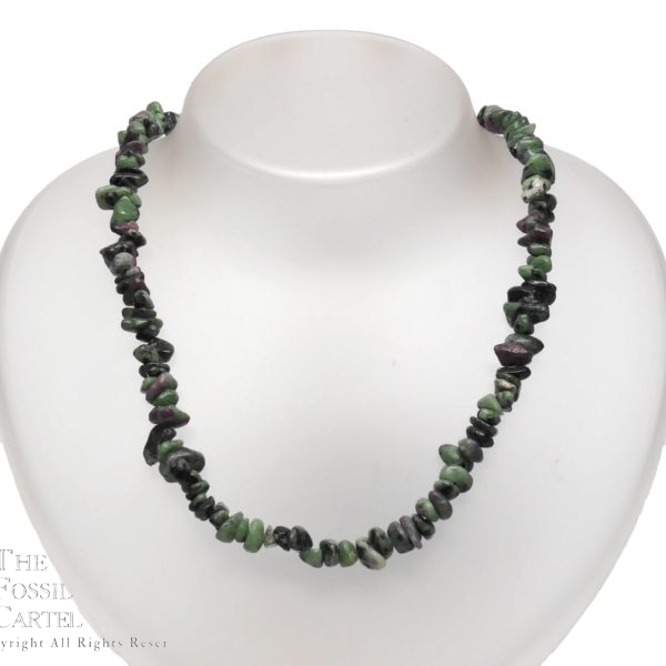A necklace made of ruby in zoisite chips against a white background