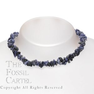 A stone chip necklace made of sodalite against a grey background