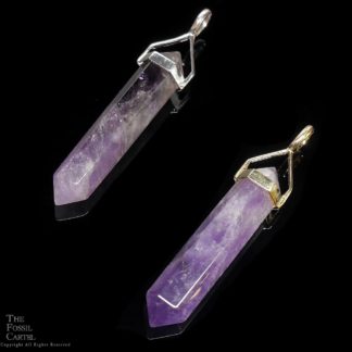 A simple crystal-shaped pendant made from a vogel cut amethyst set in sterling silver against a white background.