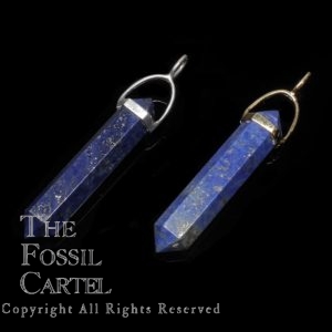 Two simple crystal shaped lapis lazuli pendants in sterling silver or gold plated against a black background