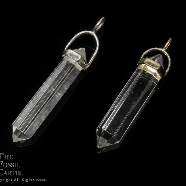 Two clear quartz crystal shaped pendants in sterling silver or gold plated against a black background