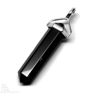 A simple crystal-shaped pendant made from a vogel cut black onyx set in sterling silver against a white background.