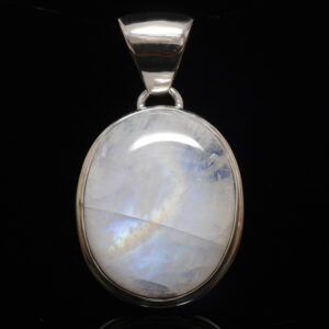 A simple sterling silver pendant featuring an oval rainbow moonstone cabochon against a black background