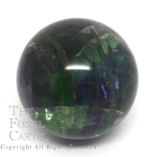 A rainbow fluorite sphere against a white background