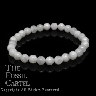 A beaded bracelet with colorless moonstone against a black background