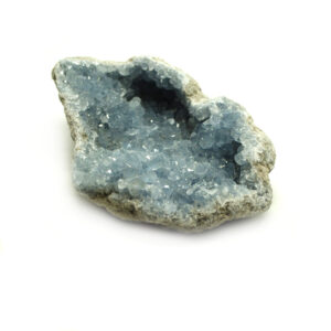 A gemmy blue celestite crystal cluster with well defined crystals against a white background