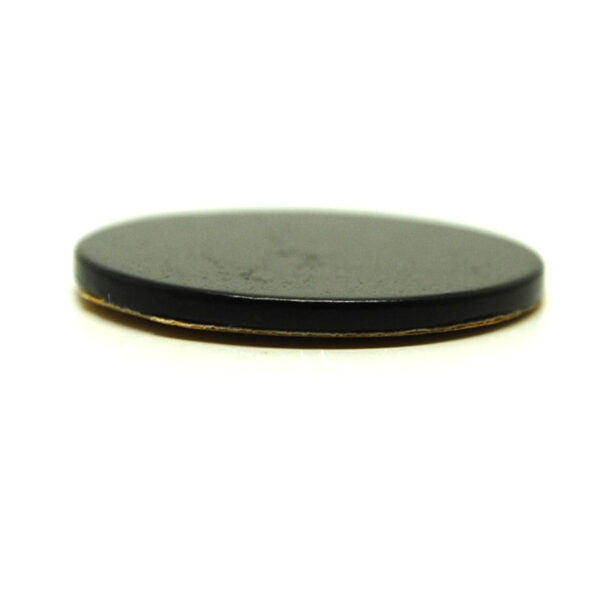 A circular shungite phone tile sticker against a white background