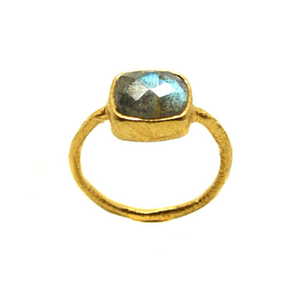 A square faceted labradorite cabochon set into a brushed vermeil-gold ring with a thin band against a white background