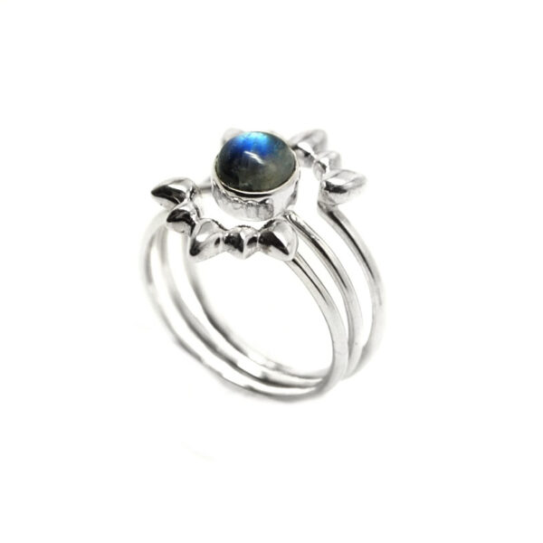 A set of rainbow moonstone stacker rings in sterling silver set against a white background