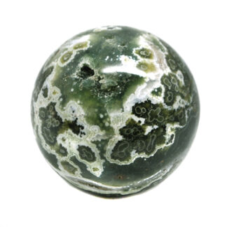 A deep green and yellow ocean jasper sphere against a white background