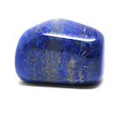 A polished lapis lazuli freeform specimen against a white background