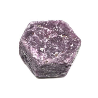 A rough ruby crystal against a white background