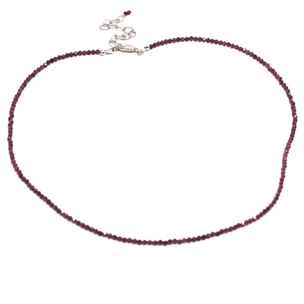 A rhodolite garnet microbead necklace against a white background