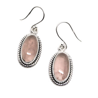 A pair of sterling silver earrings featuring oval rose quartz cabochons with decorative roping around the setting against a white background