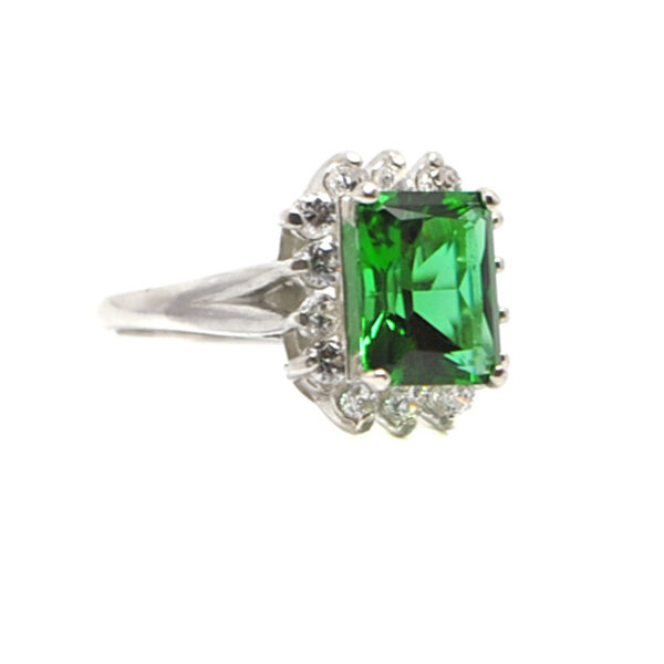 Emerald Obsidianite emerald cut Sterling Silver Ring with Cubic Zirconium accents surrounding the gemstone against a white background