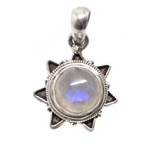 A round rainbow moonstone sterling silver pendant with a star bezel against a white background