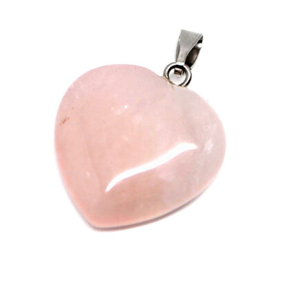 A rose quartz heart pendant against a white background
