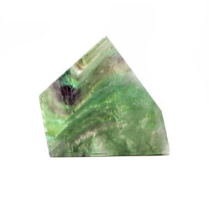 A cut and polished rainbow fluorite slab with bright green and purple tones against a white background