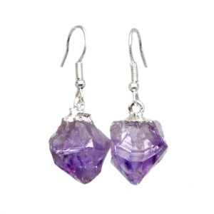 A pair of amethyst crystal earrings with simple ear hooks against a black background