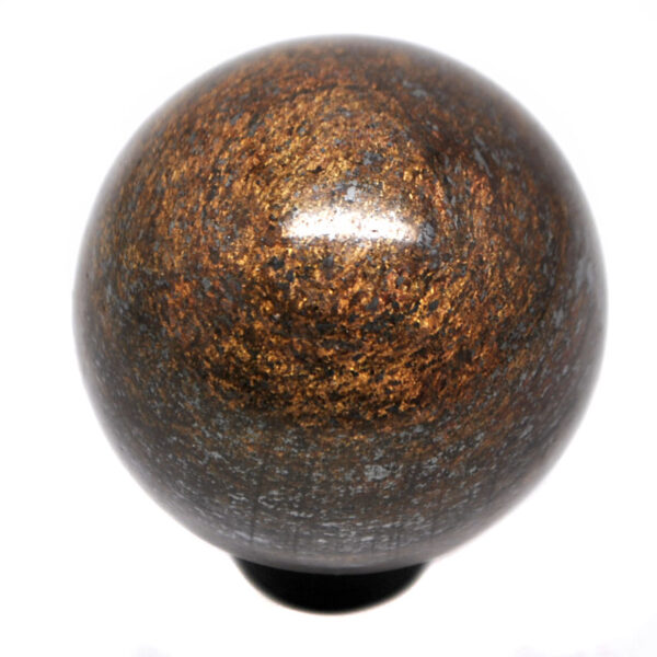 A polished bronzite sphere on a black ring stand against a white background