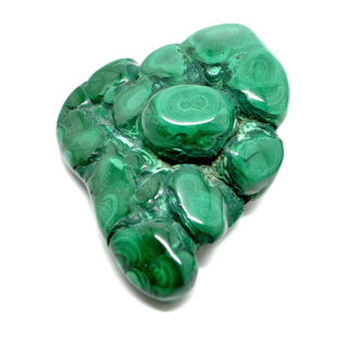 A polished free form green malachite specimen with defined banding against a white background