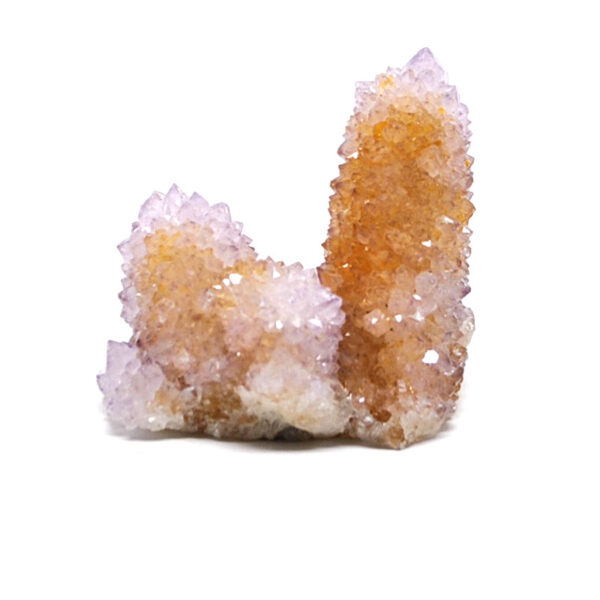 A spirit quartz crystal cluster against a white background