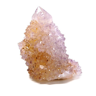 A spirit quartz crystal point against a white background