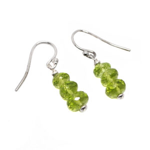 A pair of sterling silver dangle earrings featuring faceted peridot beads stacked on top of eachother against a white background
