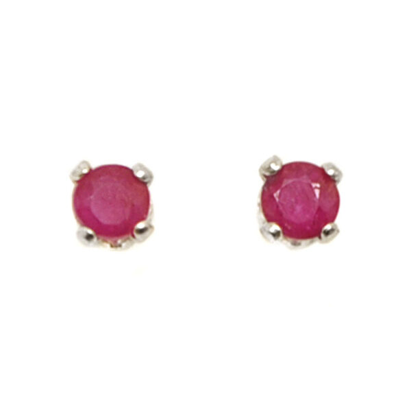 A pair of sterling silver stud earrings prong-set with round faceted ruby gemstones against a white background