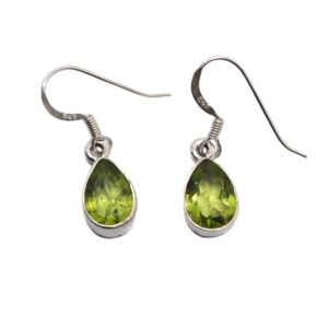A pair of sterling silver dangle earrings set with teardrop faceted peridot gemstones against a white background