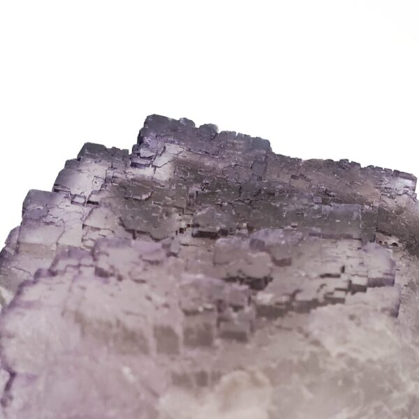Medium Purple Fluorite Cluster against a white backround.