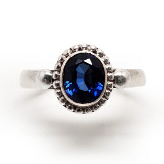 Sapphire Faceted Oval Sterling Silver Ring photagrahed against a white background