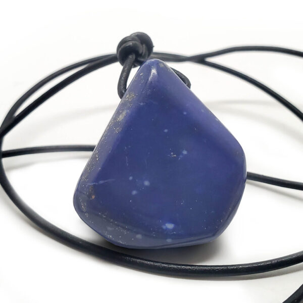 A Lapis Lazuli Drilled Pendant with a black leather rope against a white background