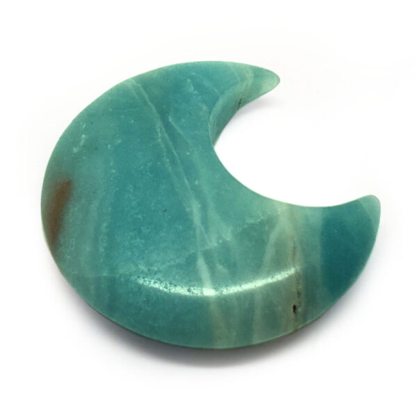 A carved amazonite moon cresent against a white background