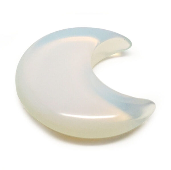 A carved opalite moon cresent against a white background